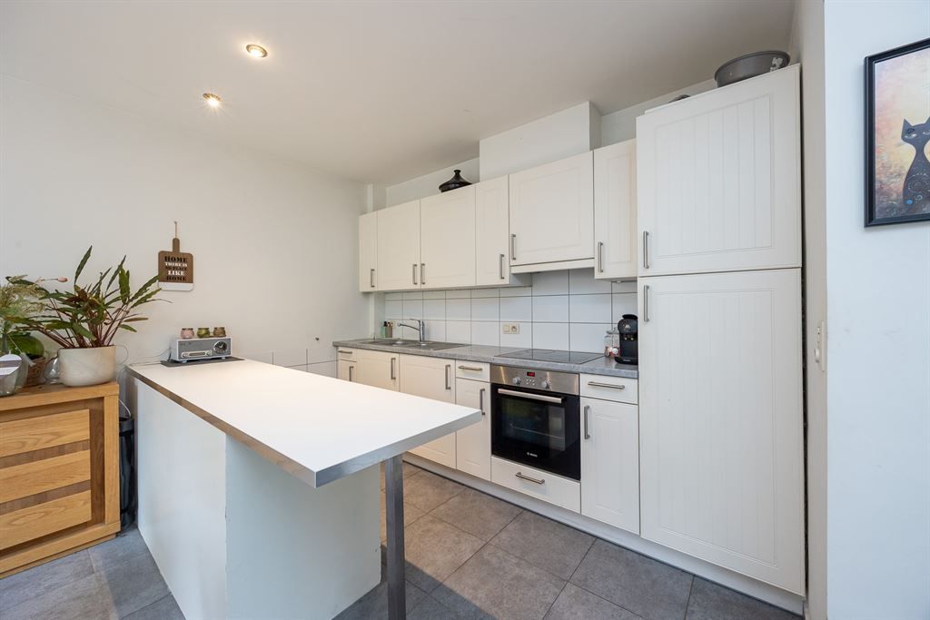 Gelijkvloers appartement met groene tuin foto 8
