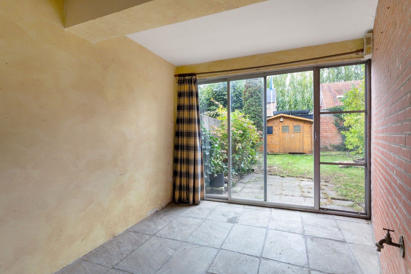 Centraal gelegen, op te frissen woning met 2 à 3 slpk., inpandige garage en tuin foto 25