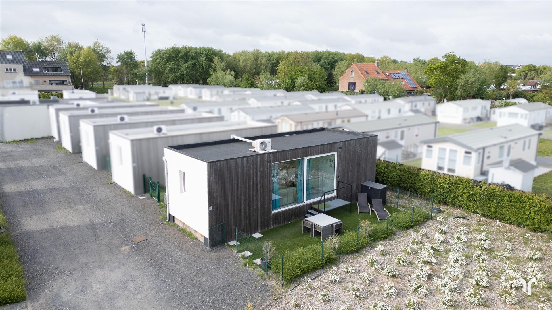 Instapklare, energiezuinige chalet op kleinschalig domein  foto {{pictureIndex}}