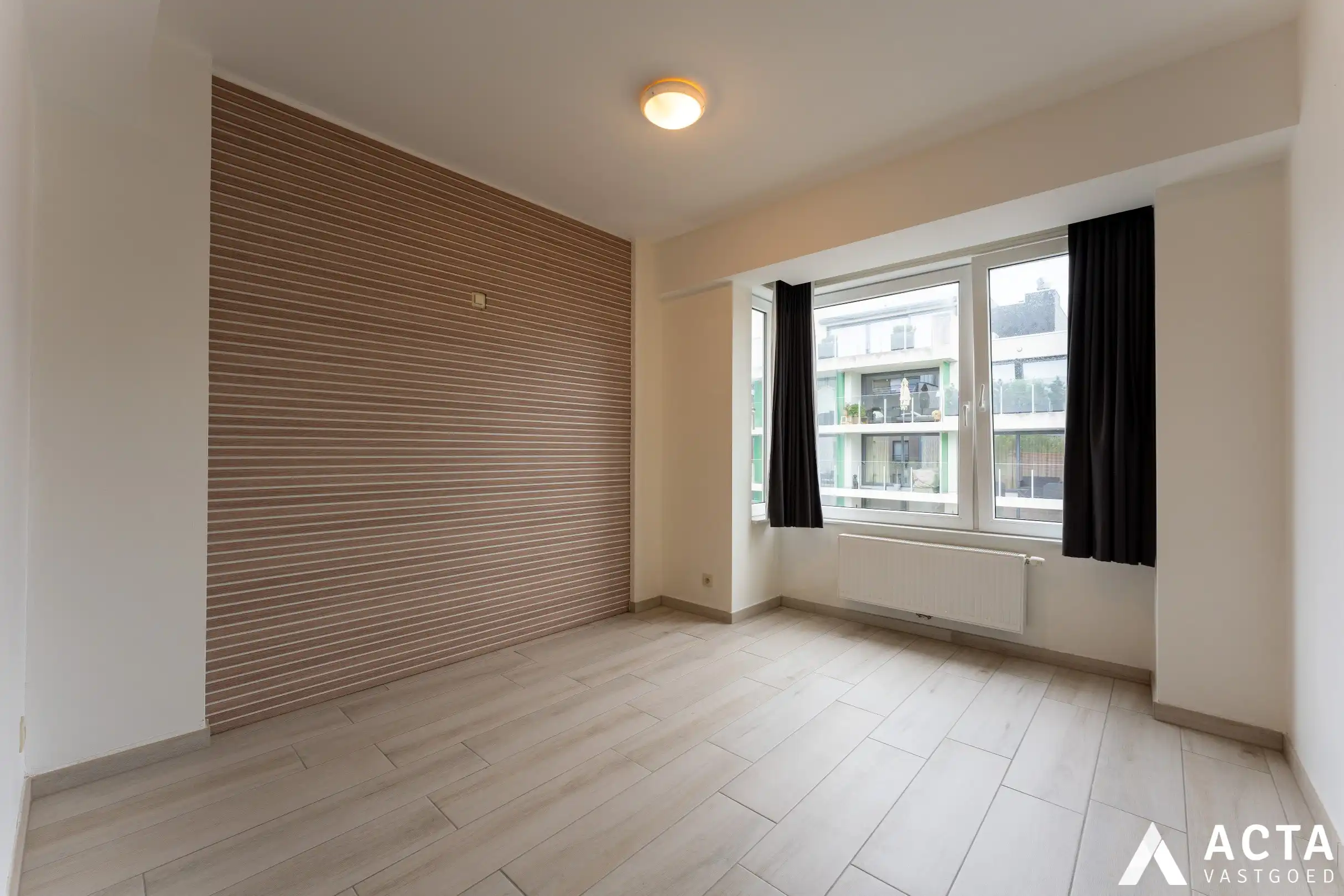 Instapklaar appartement met twee slaapkamers en parkzicht. foto 9