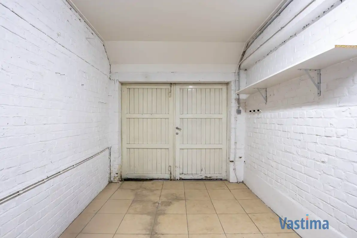 Op te frissen gezinswoning met 3 slaapkamers, garage en tuin foto 11