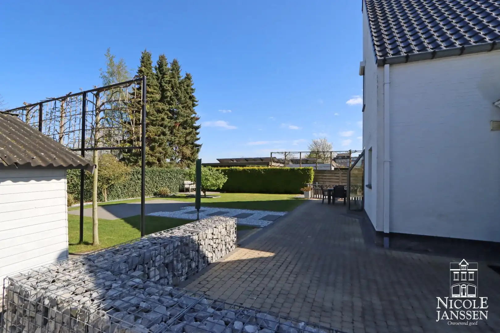 Instapklare woning met ruimte voor praktijk en mooie ingesloten tuin in Bree centrum foto 35