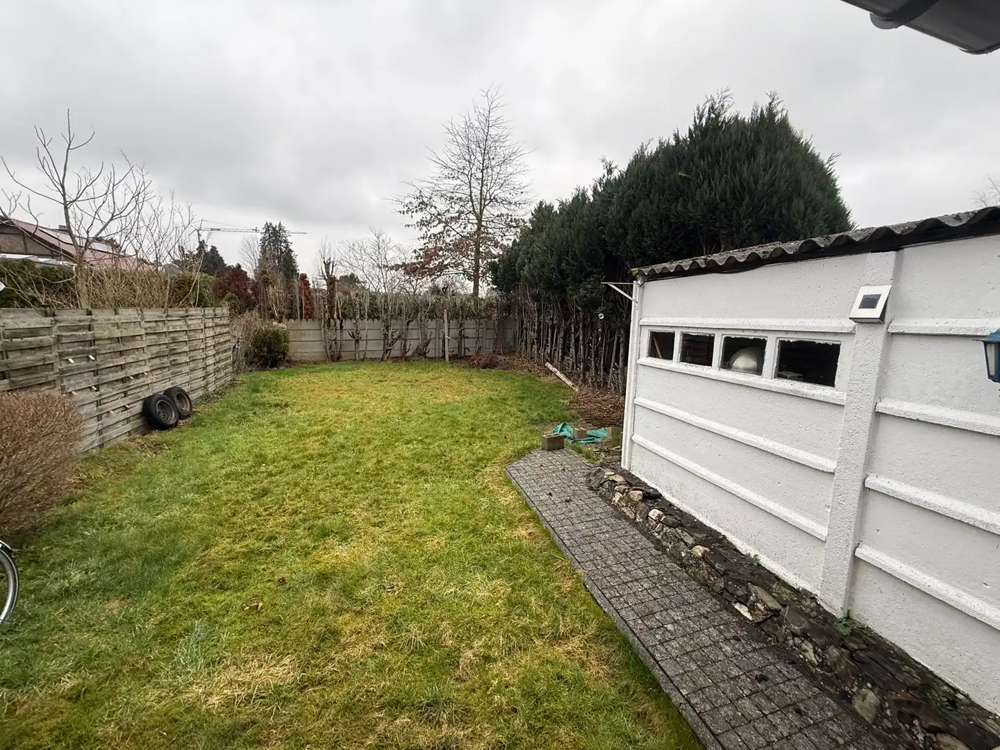 Opbrengsteigendom bestaande uit 2 halfopen woningen met garage en tuin te Hechtel. foto 18