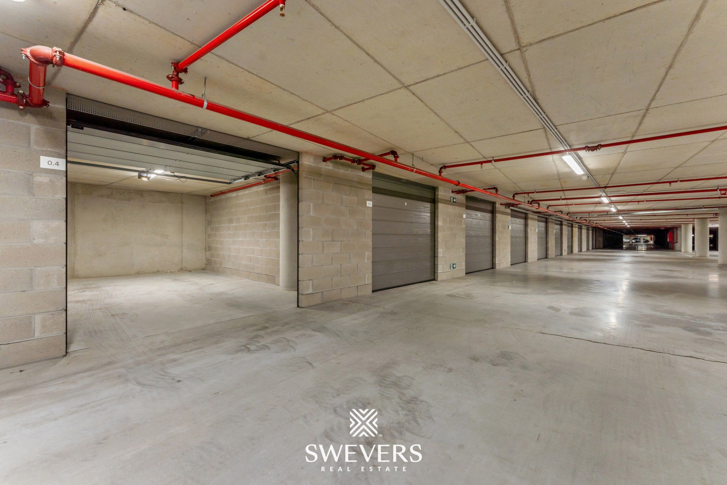 Ruime en beveiligde ondergrondse garagebox te huur in Quartier Blue foto 10