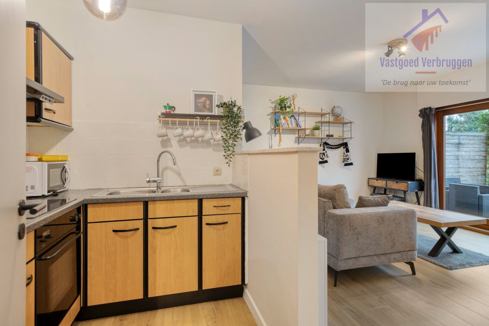 Gelijkvloers appartement met garagebox en prachtige tuin foto 6