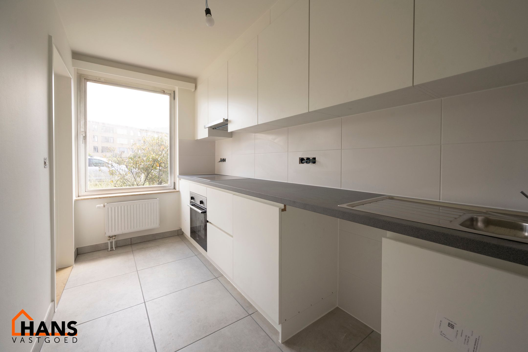 Gerenoveerd gelijkvloers appartement met tuin foto 4