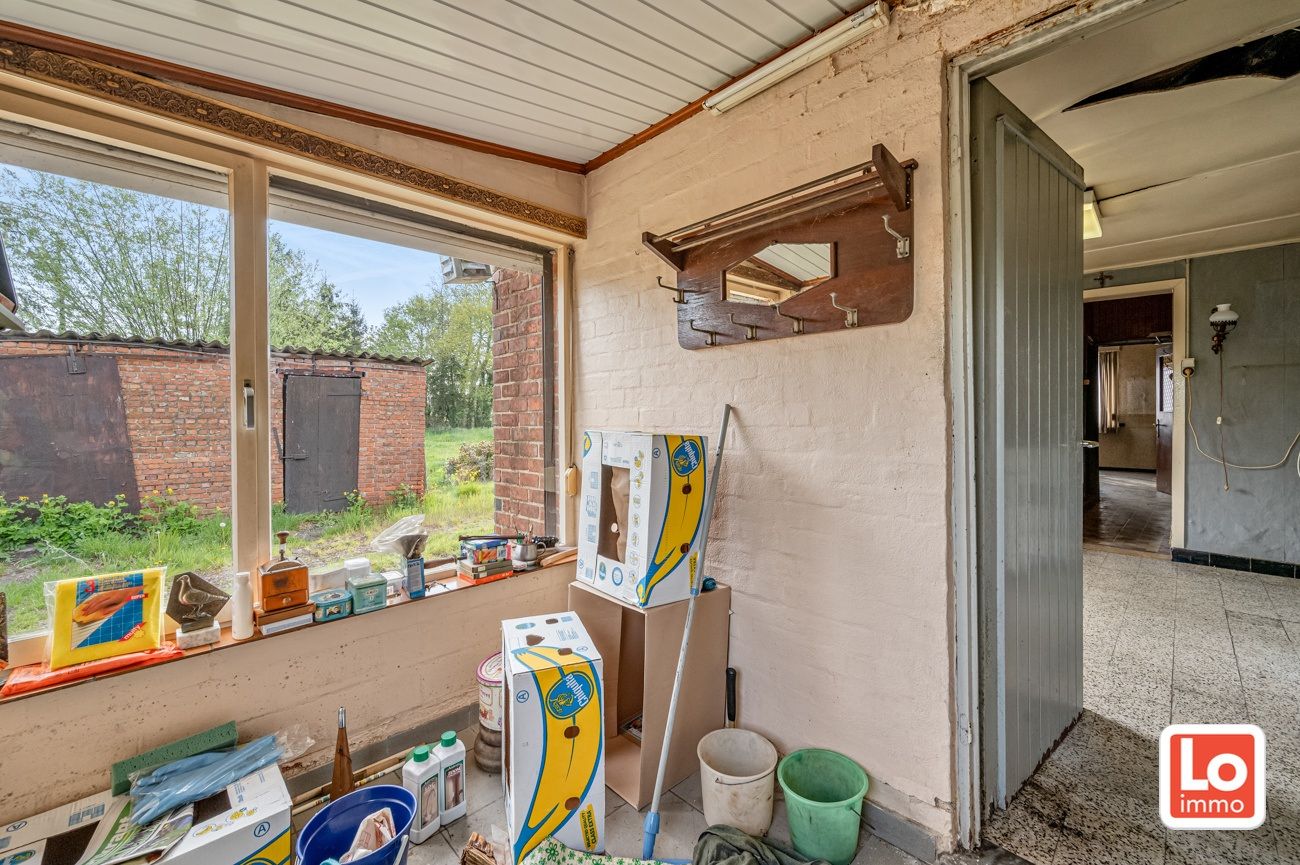 Landelijk gelegen halfopen woning met verschillende stallingen op groot perceel grond met open zicht in Zeveneken! foto 13