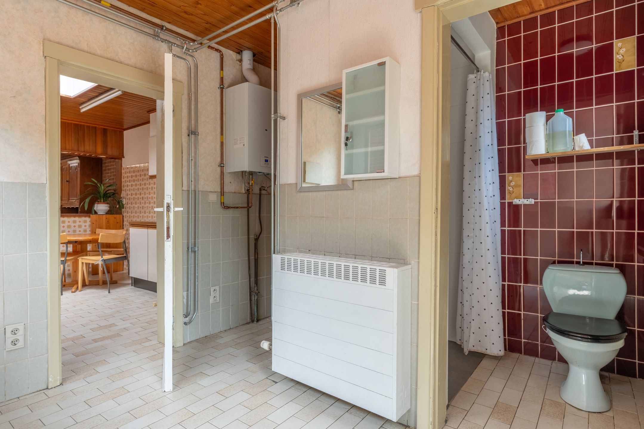 Te renoveren woning met toffe tuin en garage in het centrum foto 14