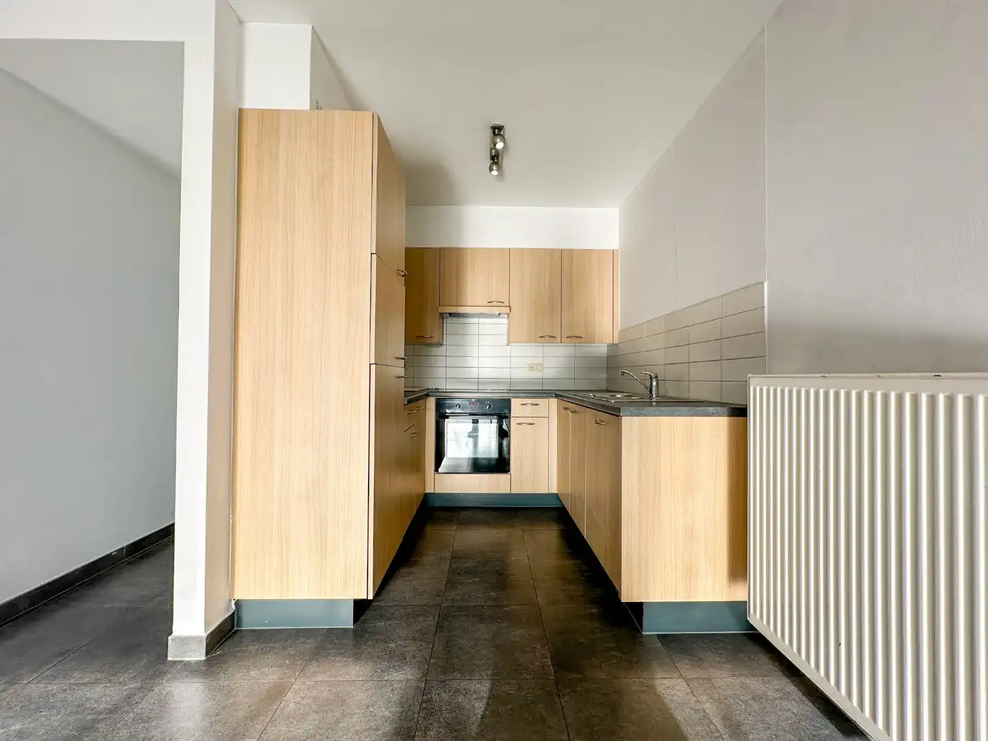 Lichtrijk gelijkvloers appartement met 2 slpk, garage en autostandplaats foto 7