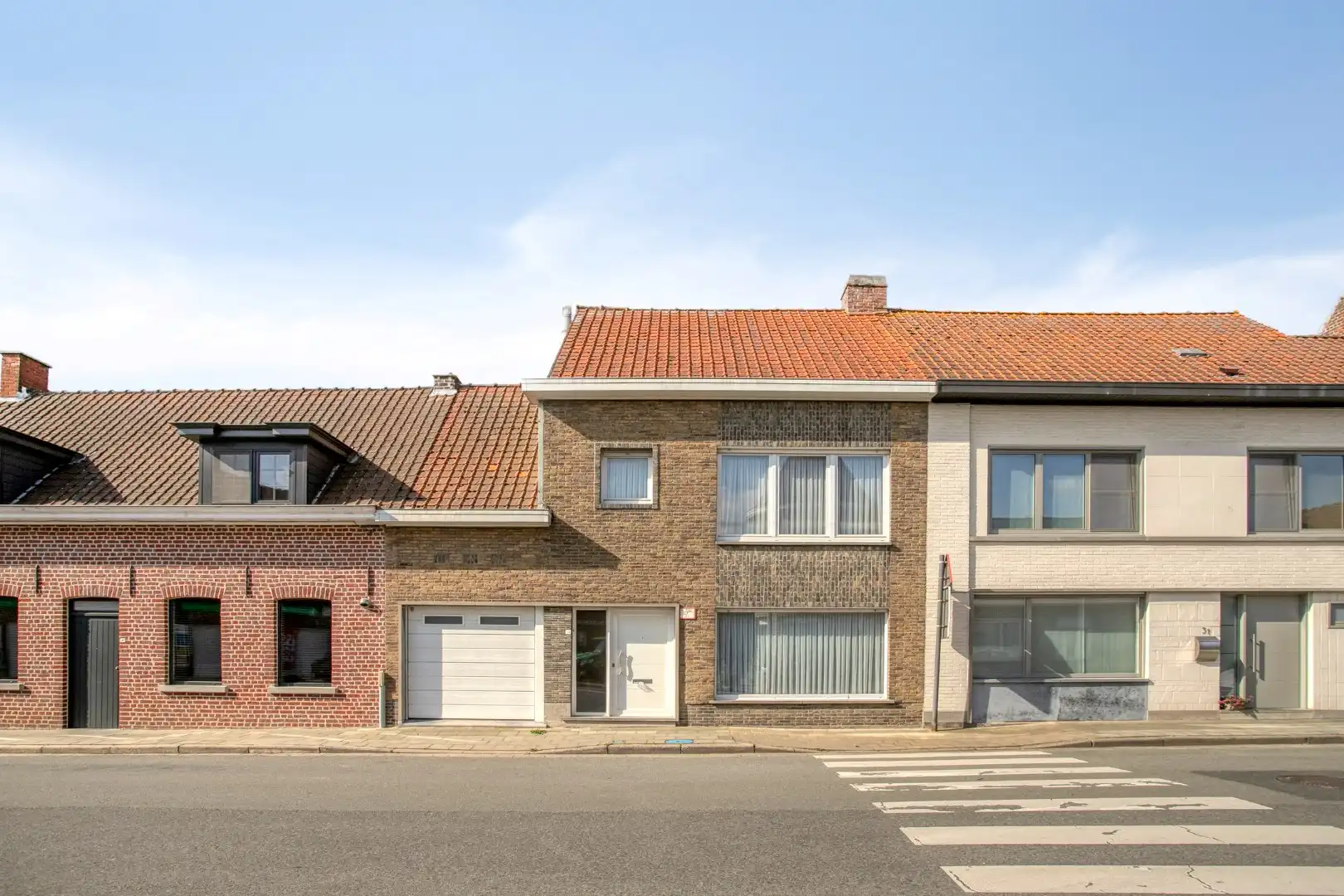 Gezellige rijwoning met 3 slaapkamers en garage! foto 2