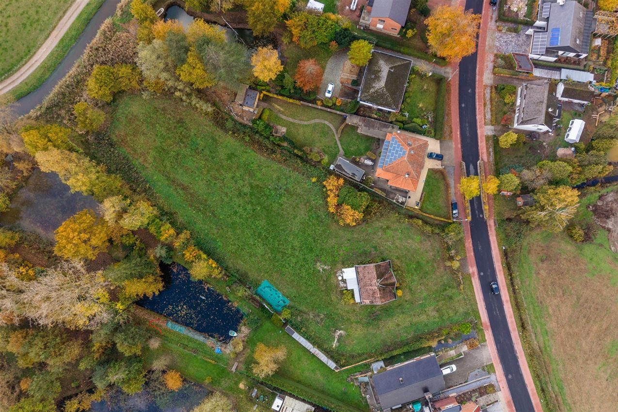 Uniek perceel van 50a33ca met af te breken woning aan agrarisch gebied foto 6