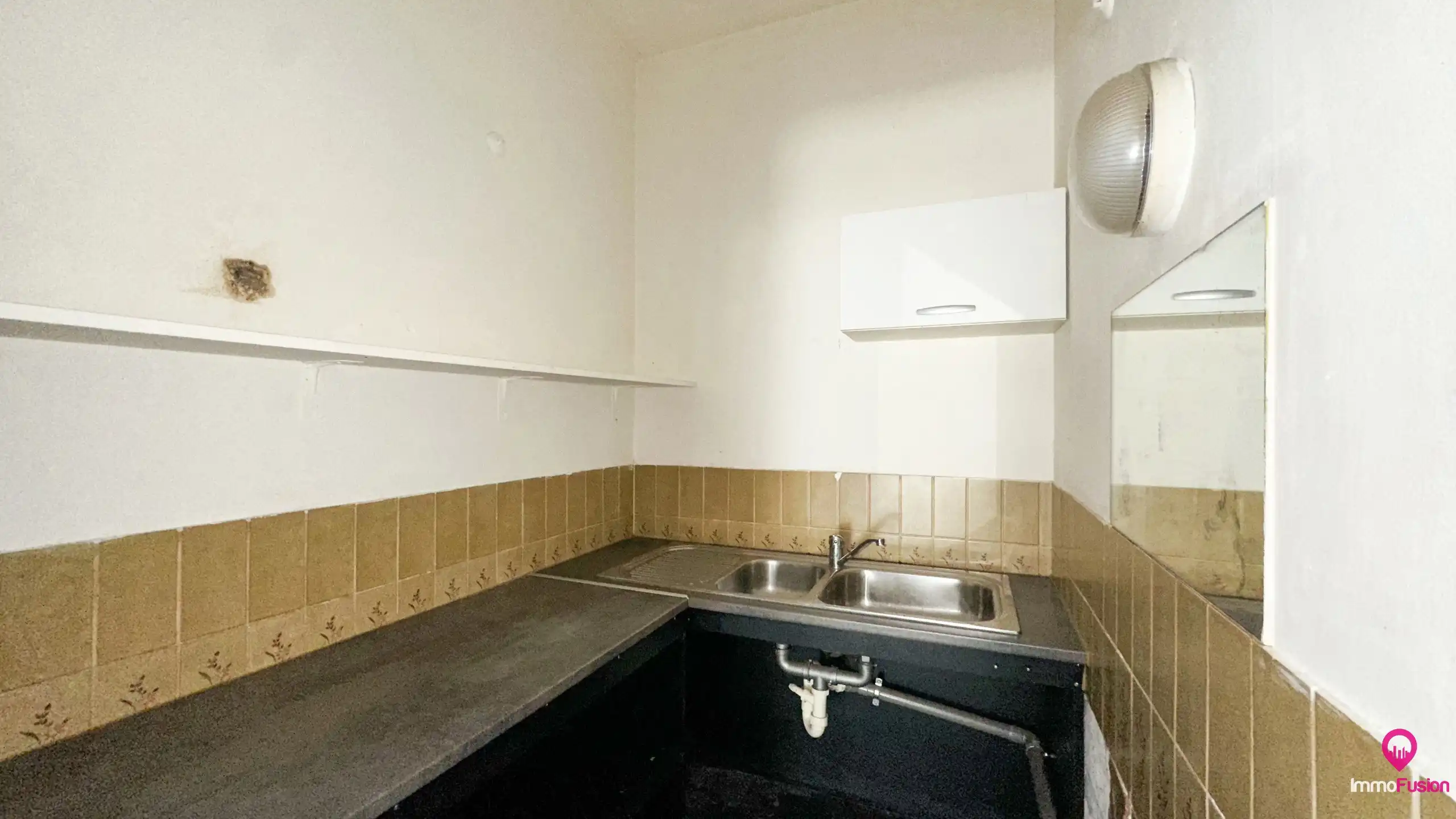 Ruim handelspand met garage in het centrum van Beringen! foto 9