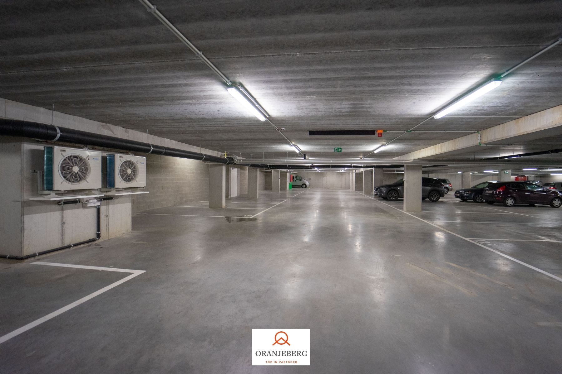 Nieuwbouw autostaanplaats te huur in afgesloten parkeergarage nabij Gent centrum foto 4
