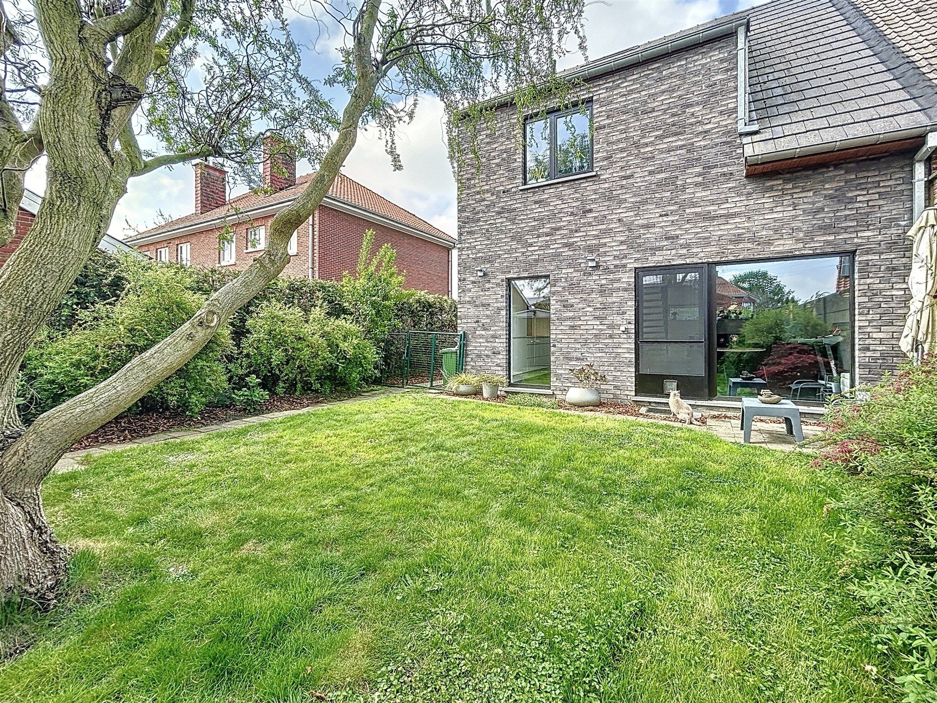 recente energiezuinige  half-open bebouwing met 3 slaapkamers en gezellige tuin! foto 5