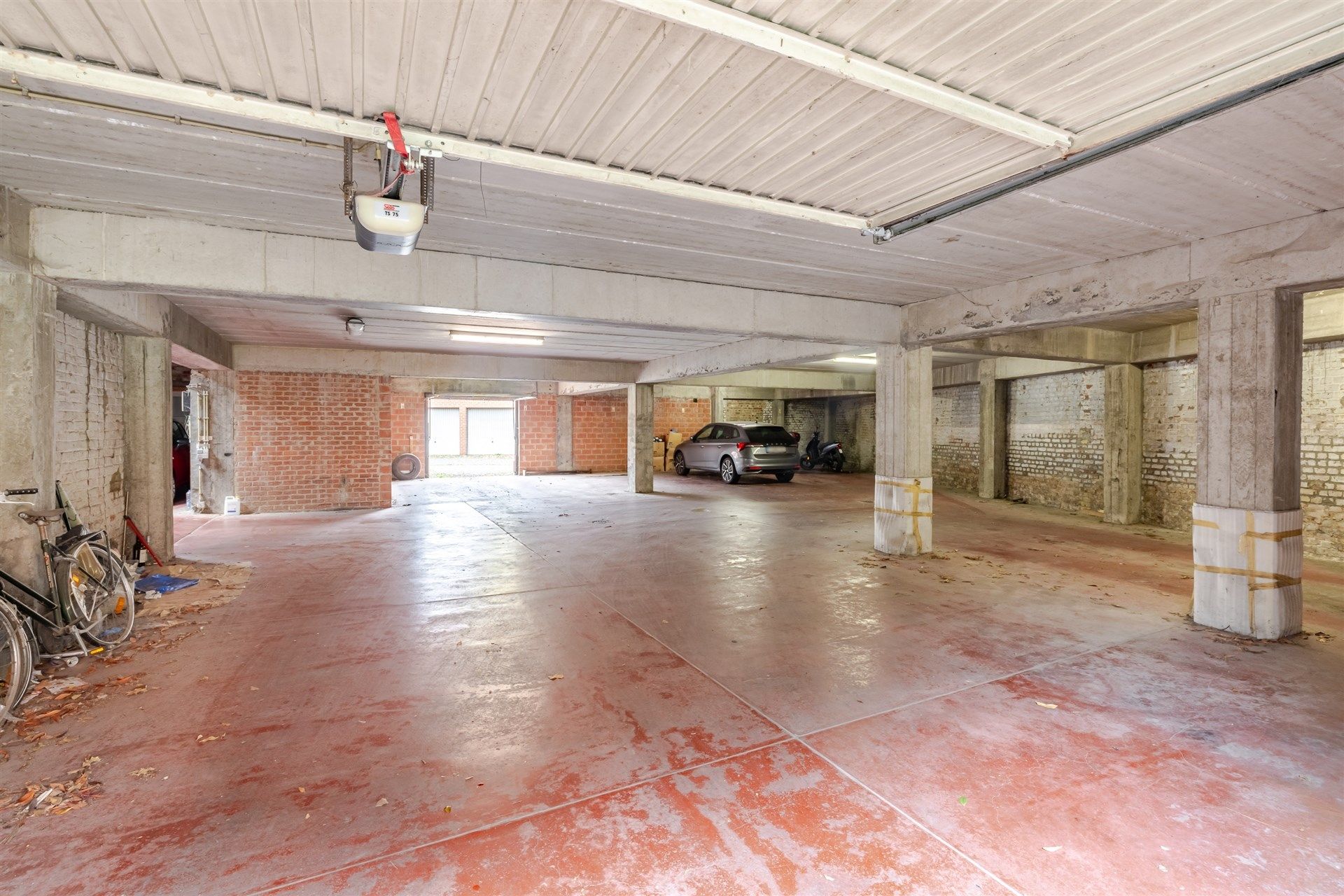 Opbrengsteigendom bestaande uit 4 appartementen + 22 garageboxen + magazijn/werkplaats foto 25