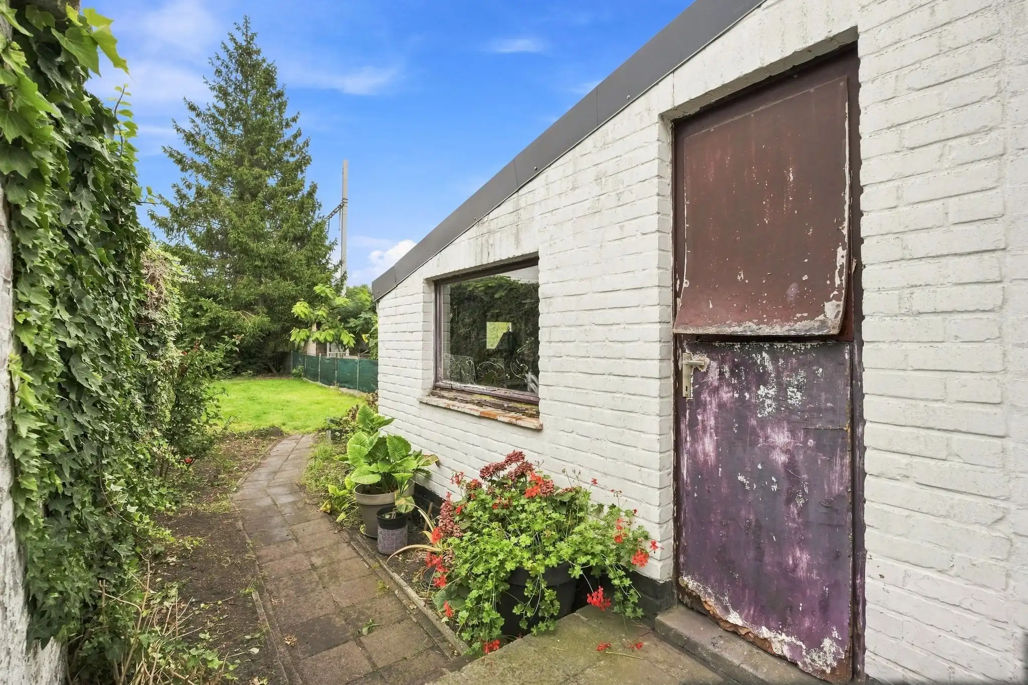 Ruime en praktische te renoveren rijwoning in Sint-Michiels foto 14