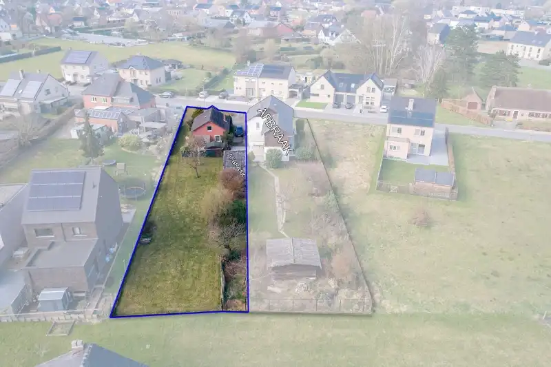 Te renoveren (uitbreidbare) woning (6% btw) of sloop/heropbouw op een rustig gelegen perceel van +- 11are op wandelafstand van het centrum van Diepenbeek! foto 2