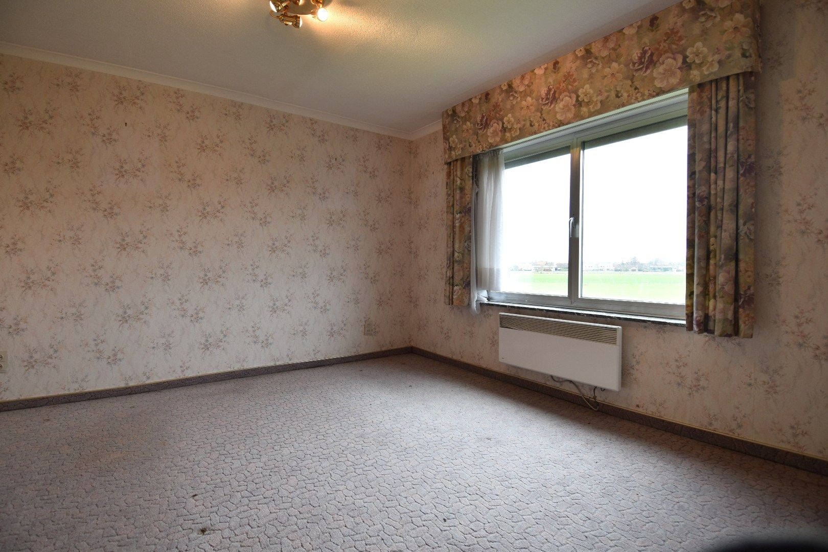 Halfopen bebouwing met 2 slaapkamers, garage en tuin in landelijke omgeving te koop in Gullegem foto 9