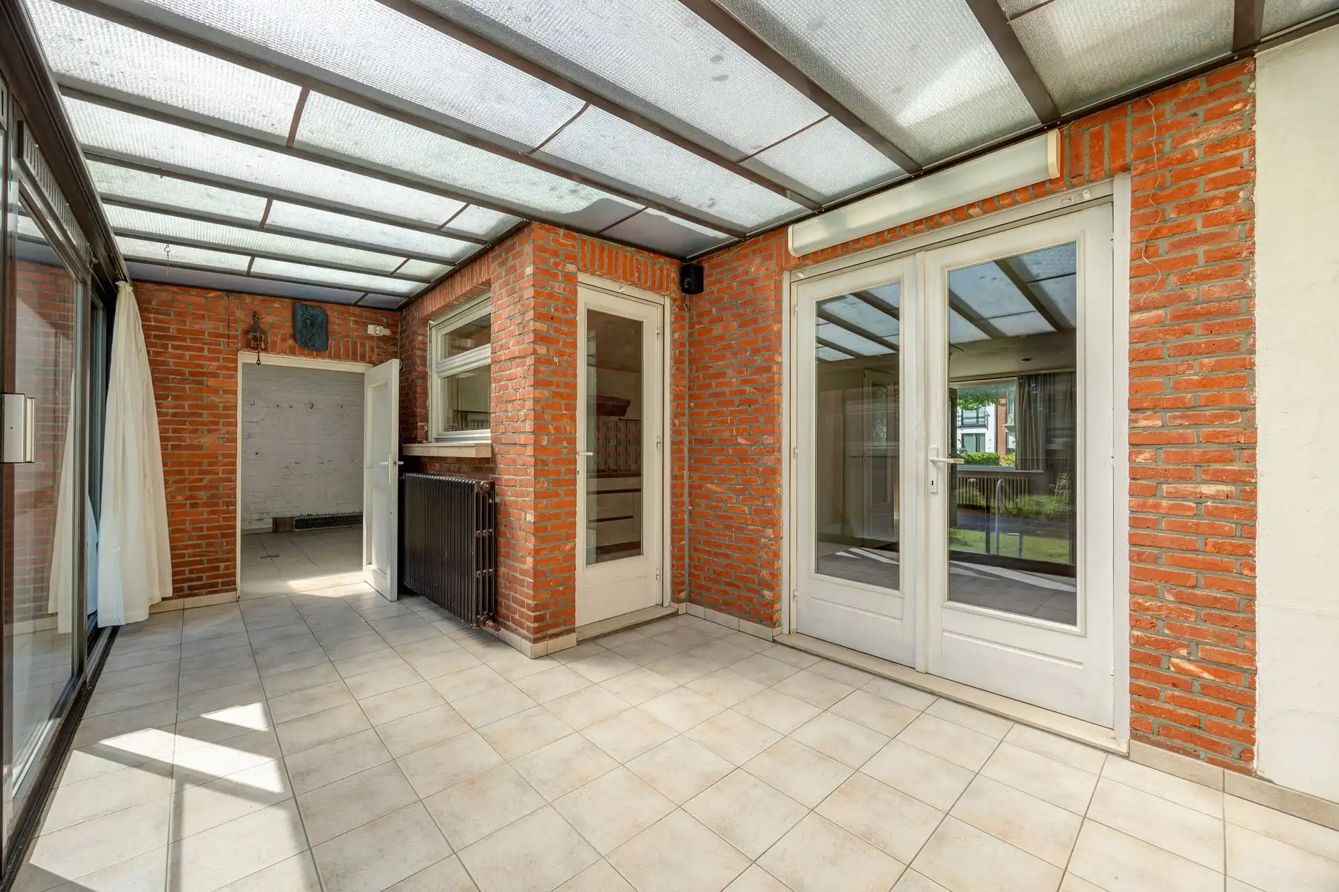 Ruime halfopen bebouwing met garage en zonnige tuin foto 28