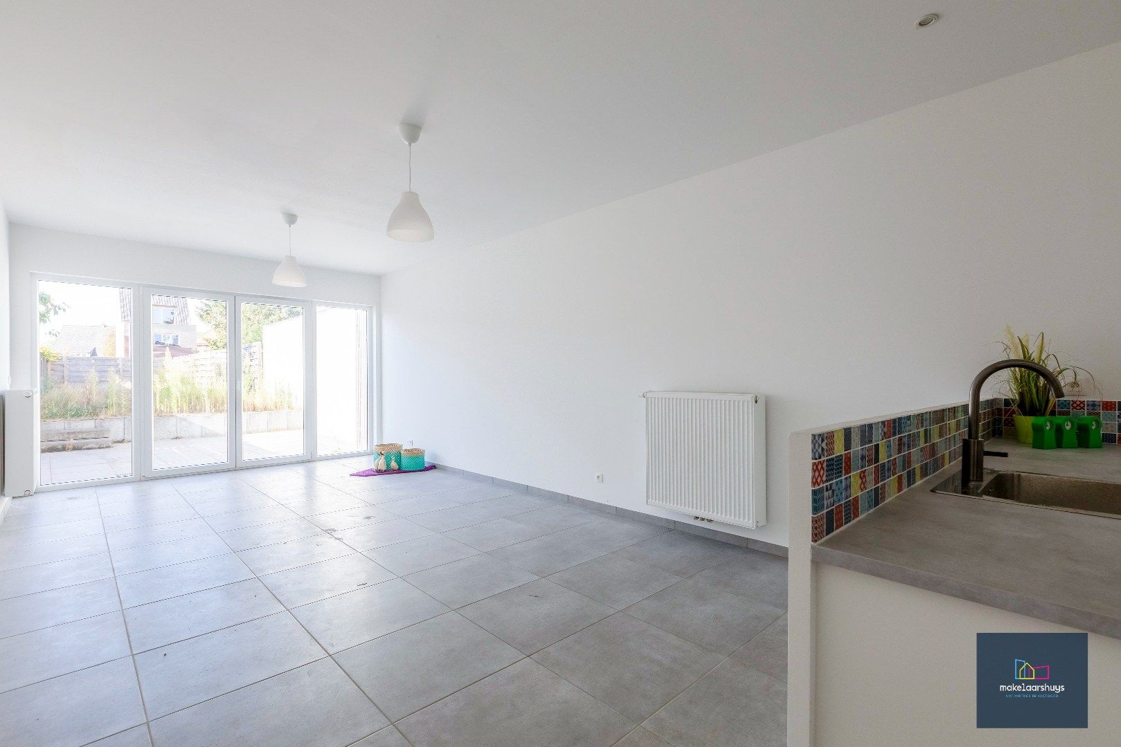 Instapklare energiezuinige woning met 3slpk tuin en staanplaats foto 4