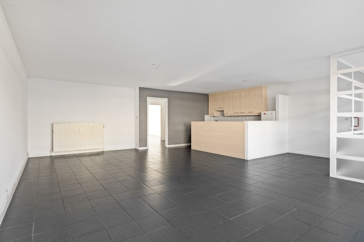 Ruim gelijkvloers appartement met 3 slaapkamers en terras in Deurne! foto {{pictureIndex}}