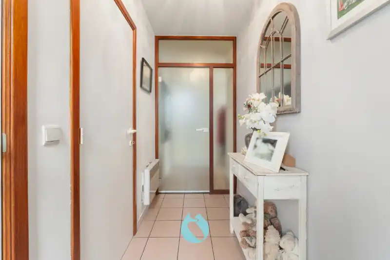 Gelijkvloers appartement met 2 slpks, tuin en garage foto 10