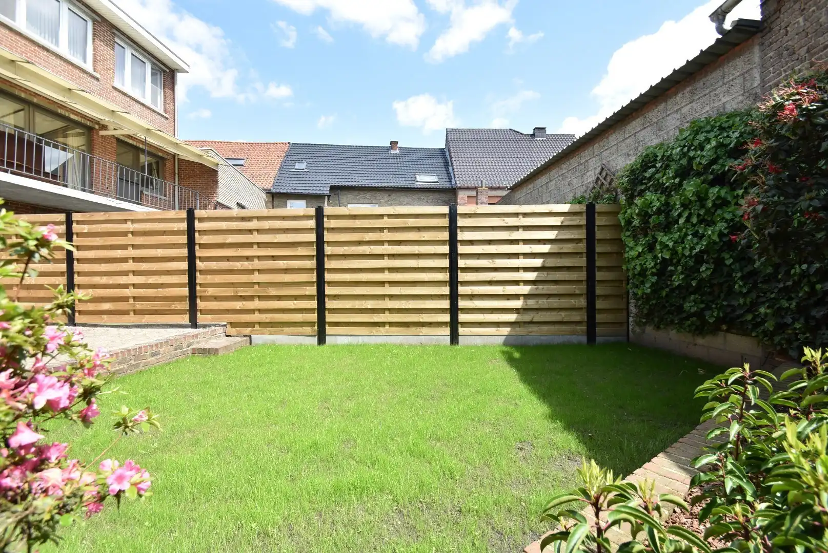 Knappe rijwoning met inpandige garage en mooie tuin in het centrum van Riemst foto 29