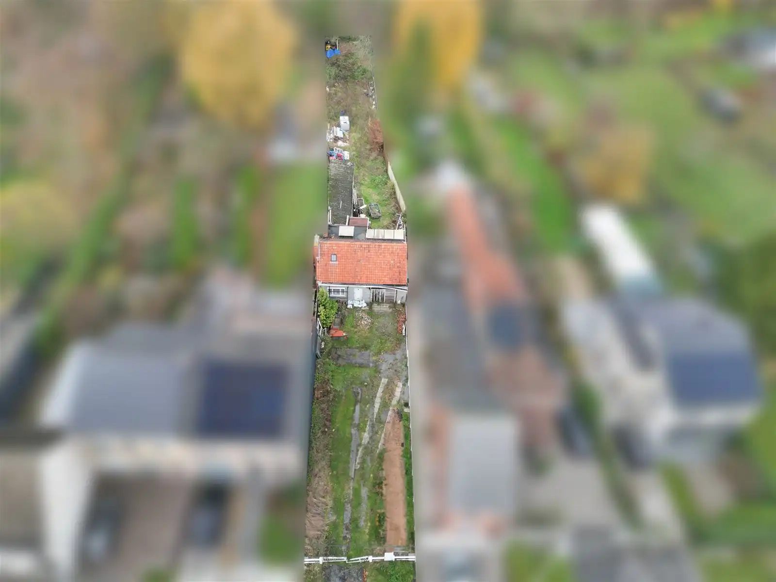 Hoofdfoto van de publicatie: Bouwgrond met pand op toplogging in Wetteren.