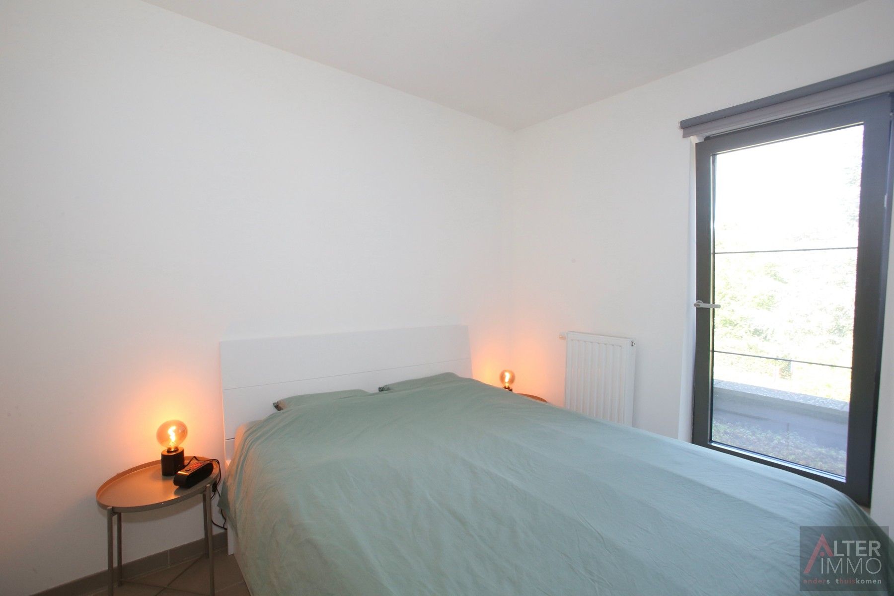 Instapklaar, centraal gelegen 2-slaapkamer appartement met terras en ondergrondse parking! foto 10