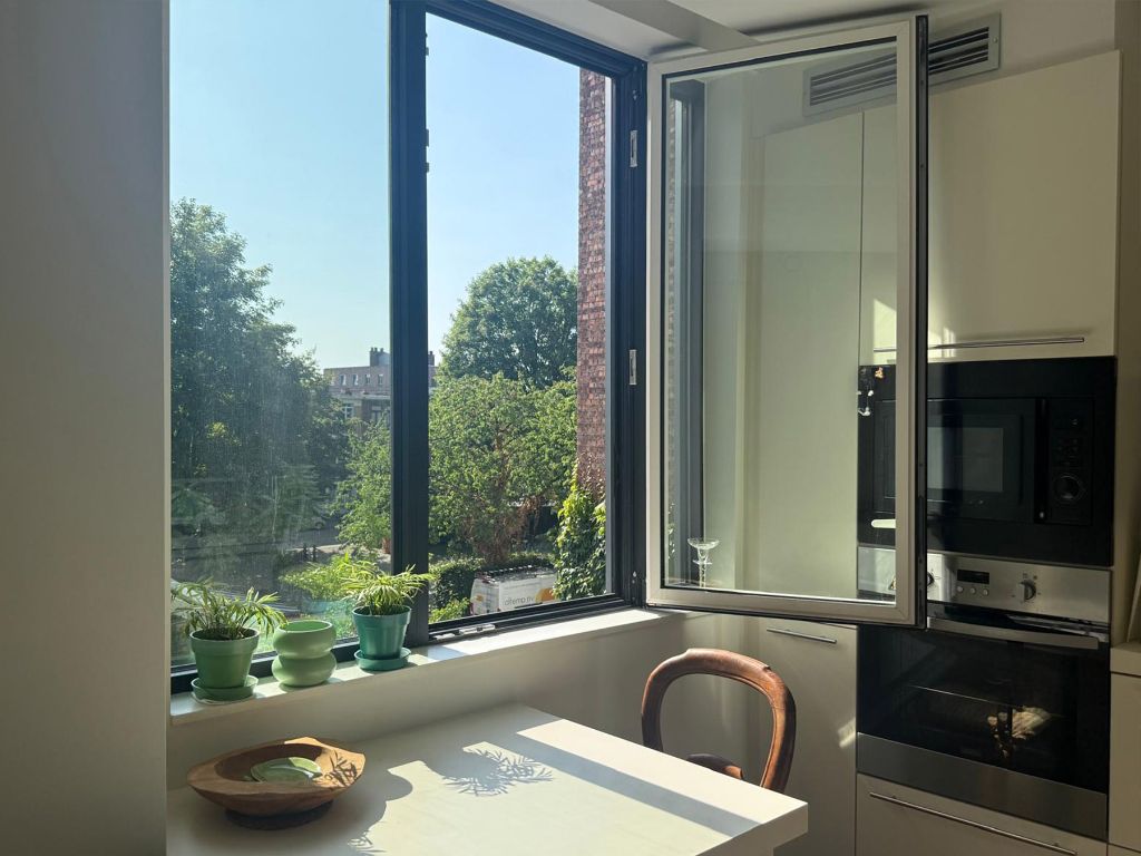 Omgeving Sint-Pietersstation. Ruim 2 slaapkamer appartement met aangenaam terras en zicht op groen, zowel aan de voor- als achterzijde foto 4