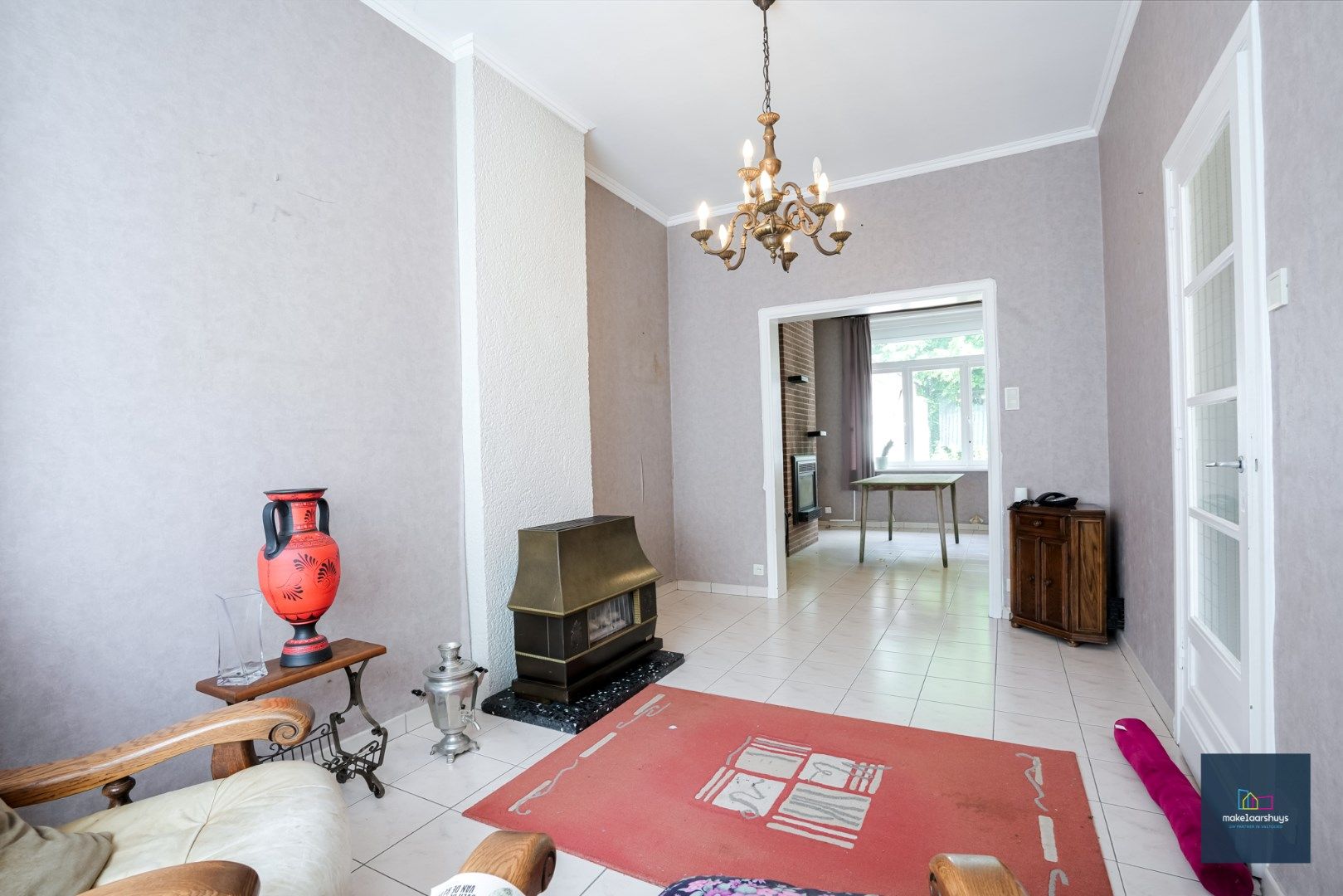 Centraal gelegen te renoveren woning in rij met tuin te Mariakerke foto 2