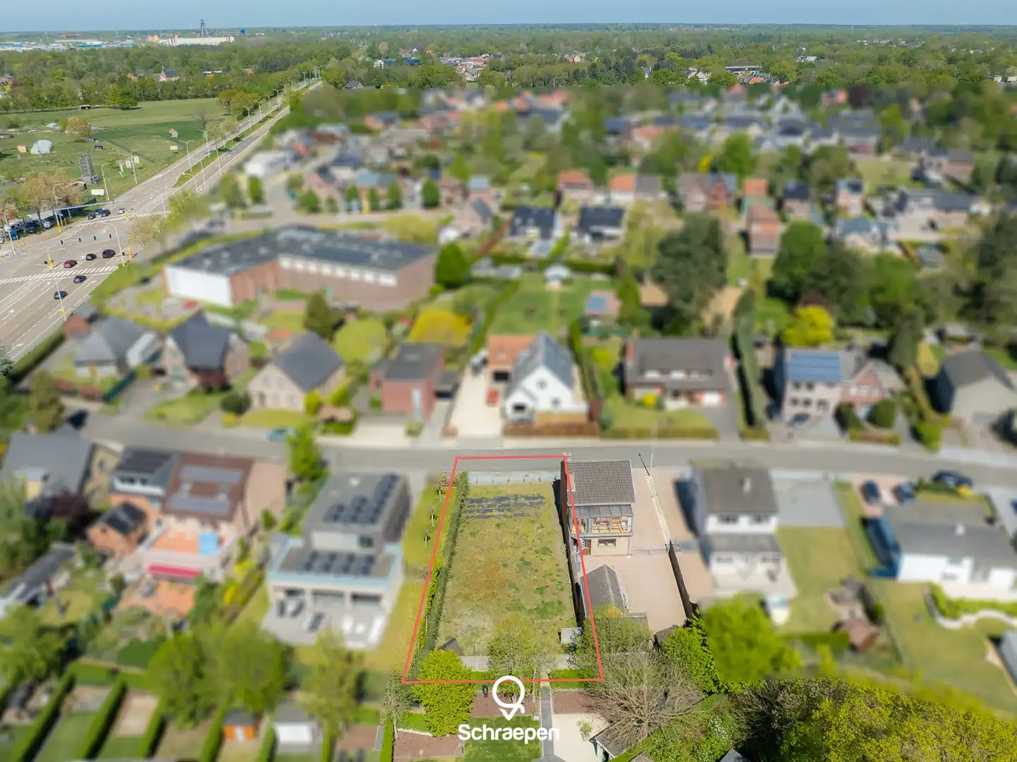 Mooie bouwgrond voor halfopen bebouwing (circa 4,5 are) op TOP-locatie in Zonhoven-centrum! foto {{pictureIndex}}