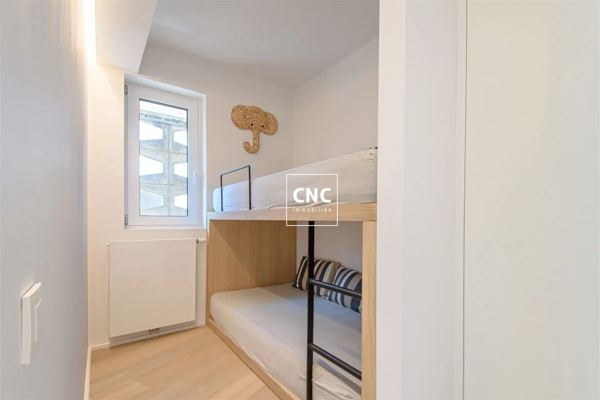 Stijlvol gerenoveerd en zonnig hoekappartement op topligging foto 16