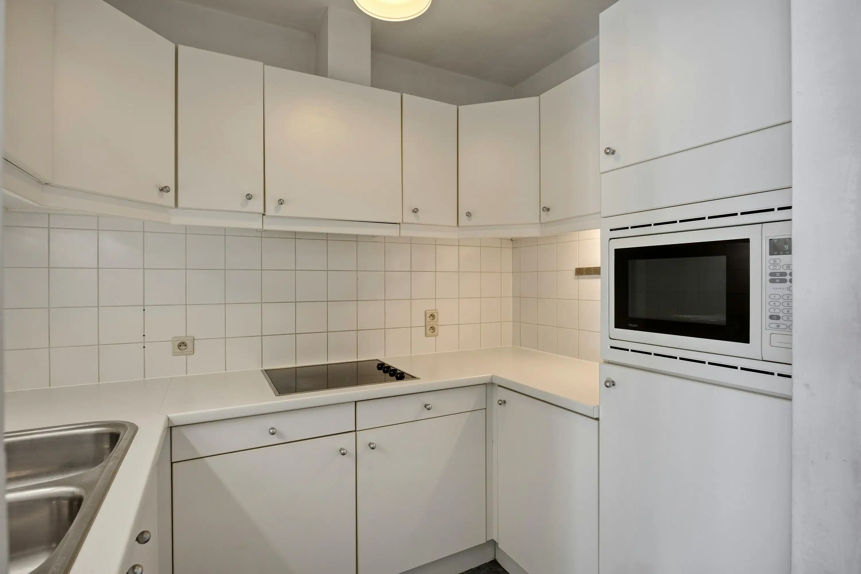 Instapklaar gelijkvloers appartement met gemeenschappelijke tuin en fietsenberging in hartje Kapellen! foto 8
