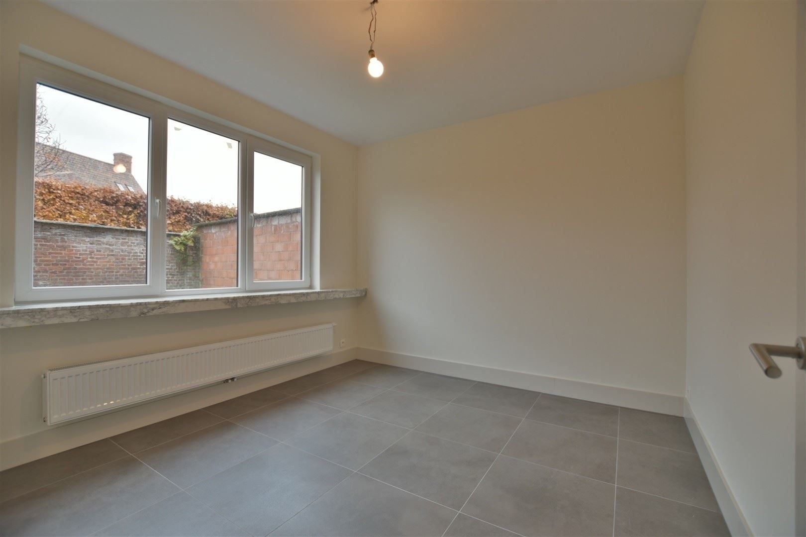 Totaal gerenoveerd GV appartement met tuin te Grembergen foto 19