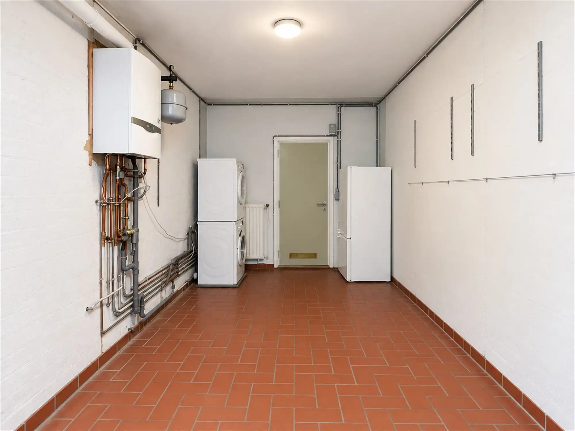 Gelijkvloers appartement met 2 slpk, garage en tuintje foto 14
