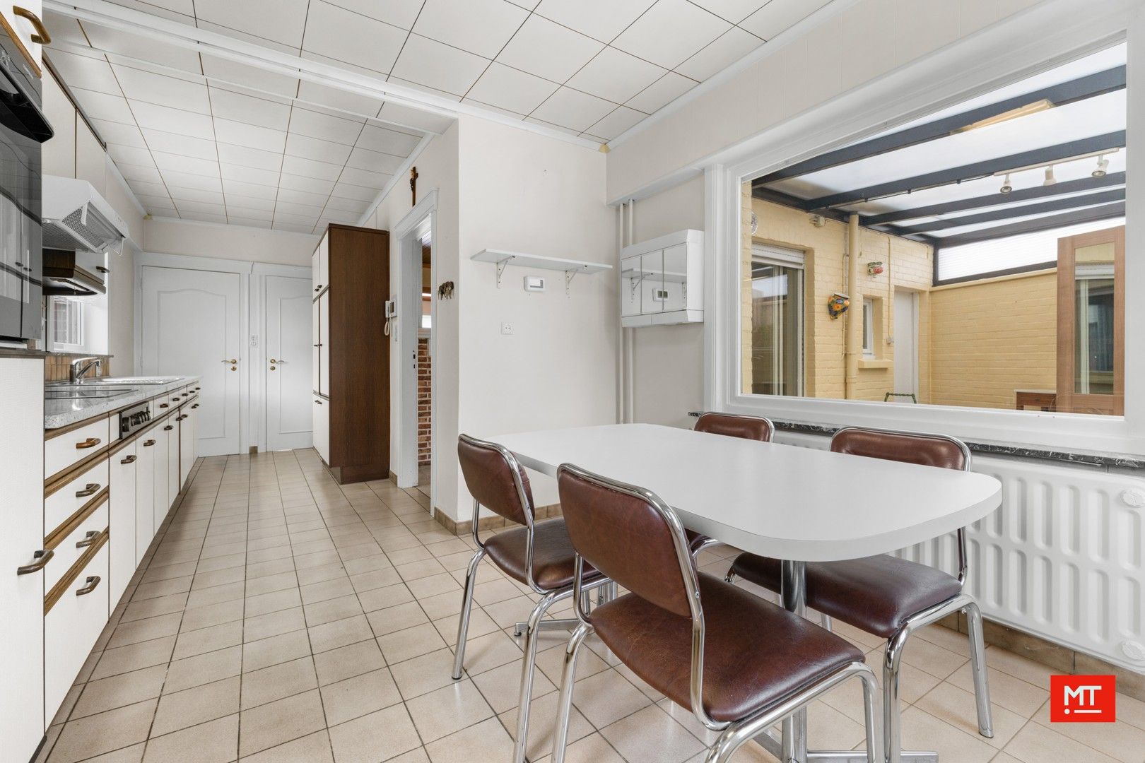 Te renoveren alleenstaande woning met 3 slaapkamers, Westgerichte tuin en garage in het centrum van Passendale foto 7