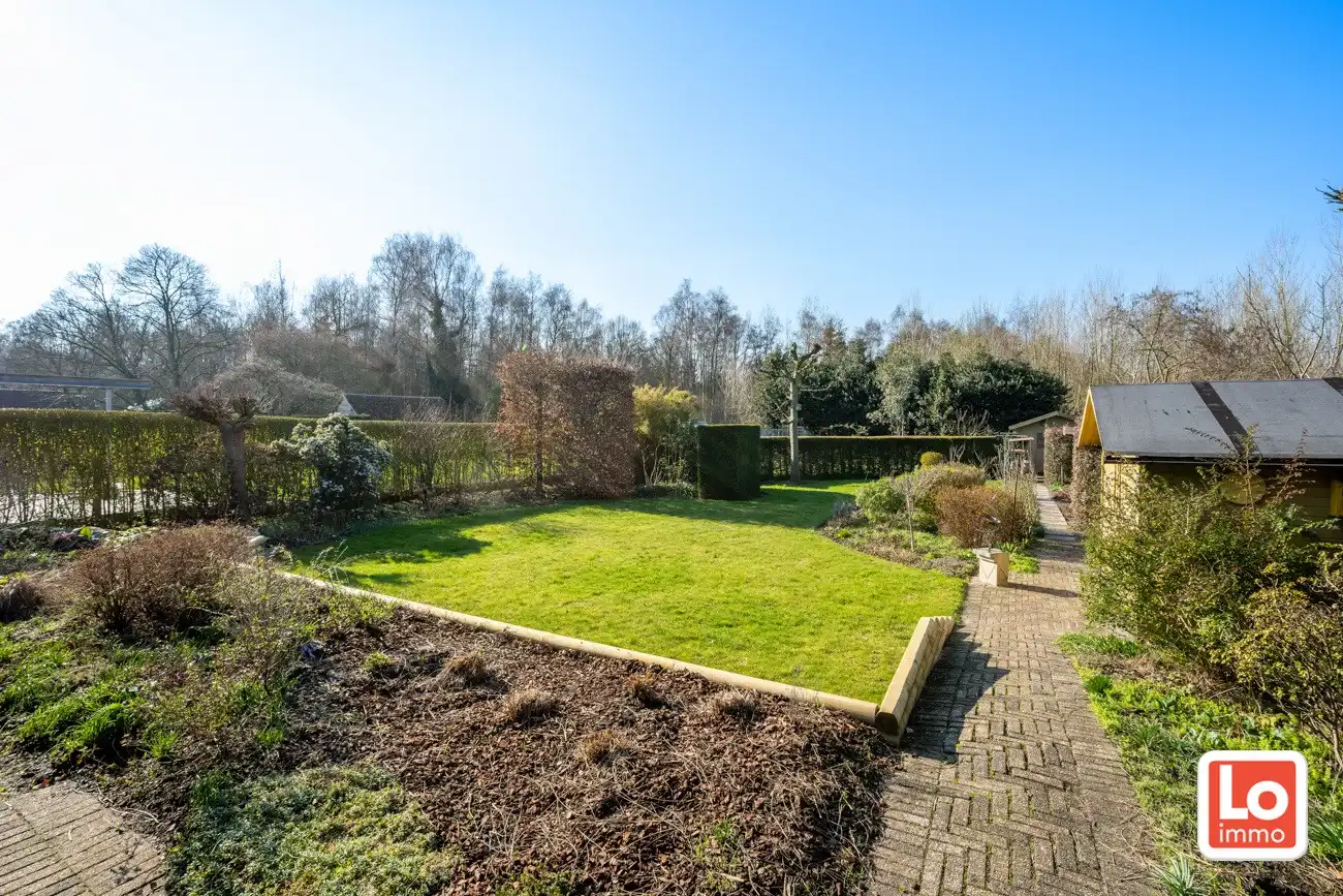 Degelijke open gelijkvloerse woning met inpandige garage en grote tuin op een groene toplocatie in Beervelde! foto 29