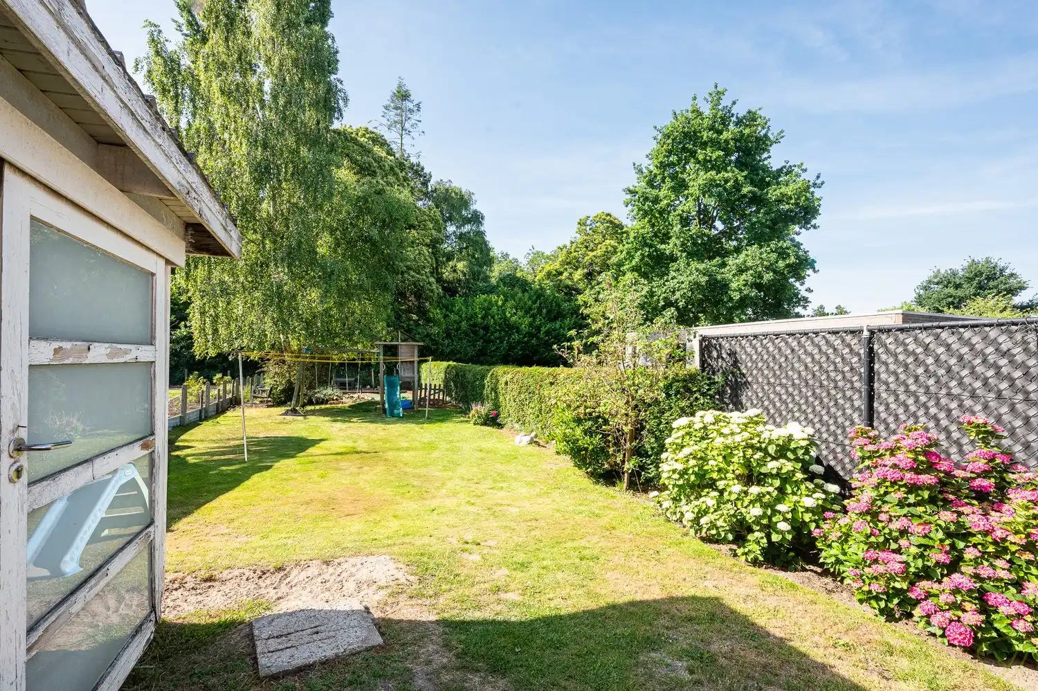 Te renoveren gezinswoning met grote tuin in het centrum van Bassevelde foto 16