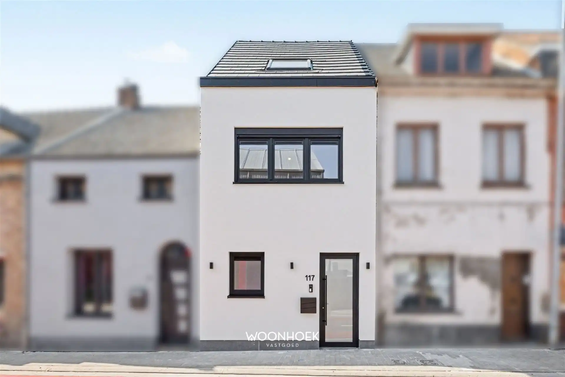 Moderne 3-slpk woning in centrum Waasmunster foto {{pictureIndex}}