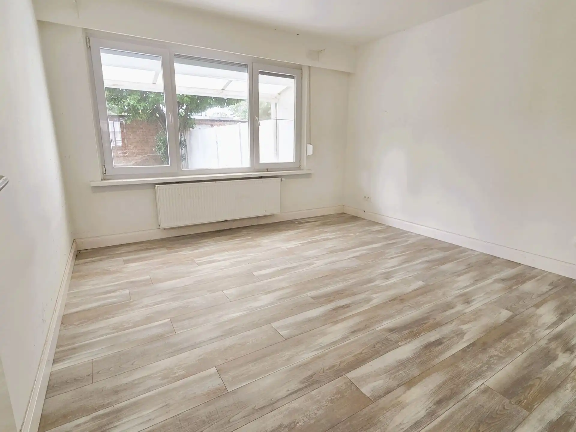 Instapklaar gelijkvloers appartement met zonnige tuin foto 5