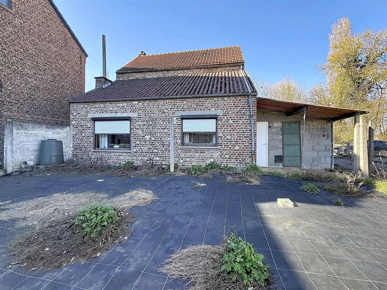Te renoveren woning met garage en tuin, opp 2a 40ca foto 3