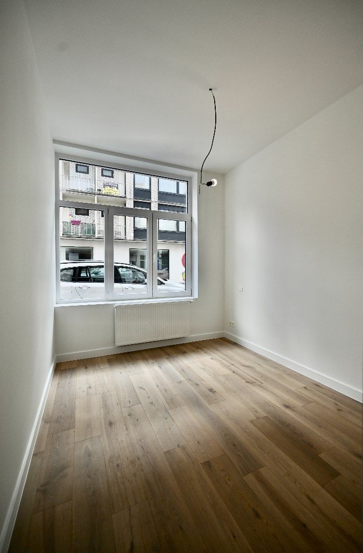 KARAKTERVOL GELIJKVLOERS APPARTEMENT MET STADSTERRASJE foto 7