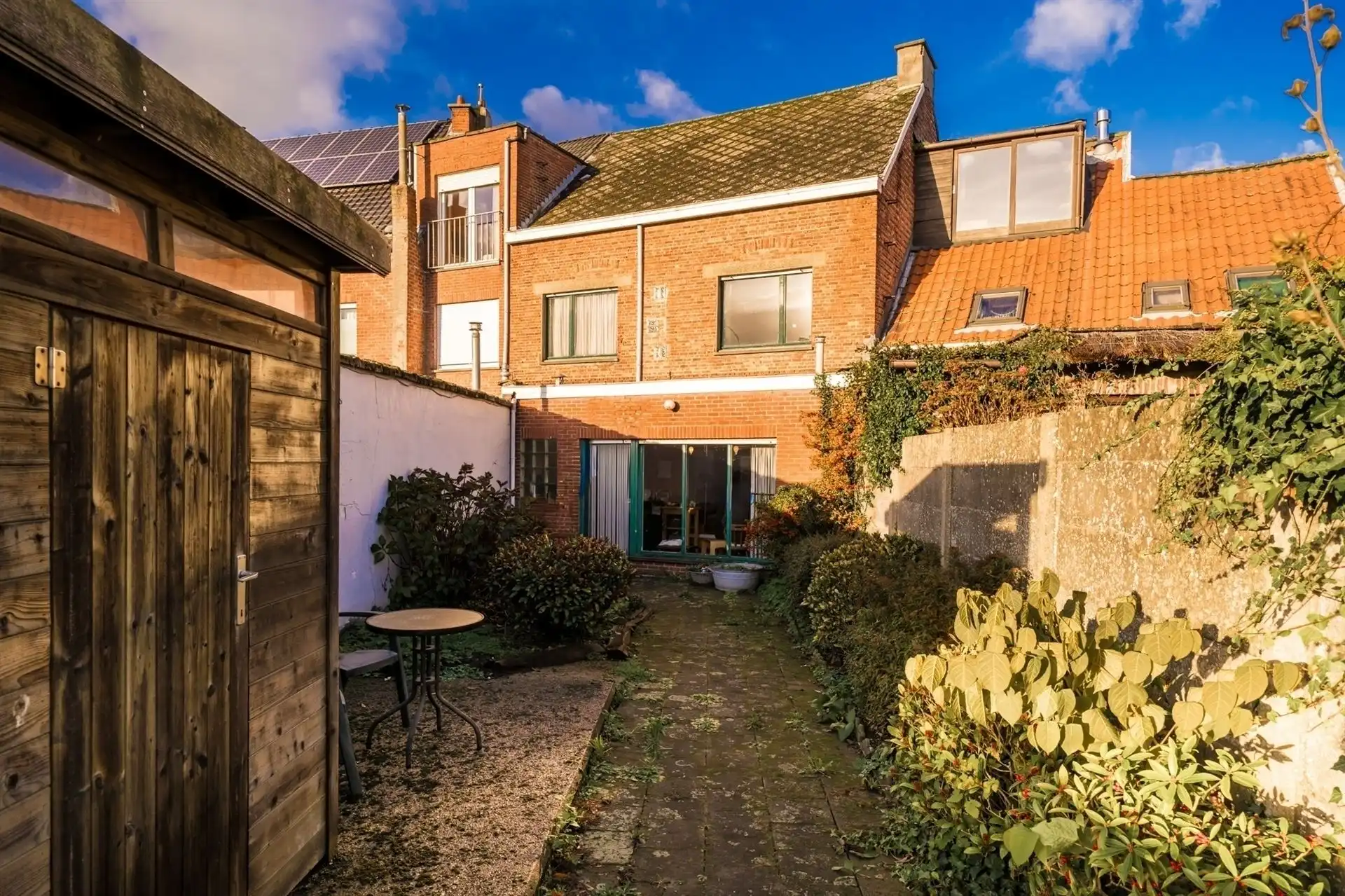 Te renoveren woning met 4 slpks en tuin. foto 24