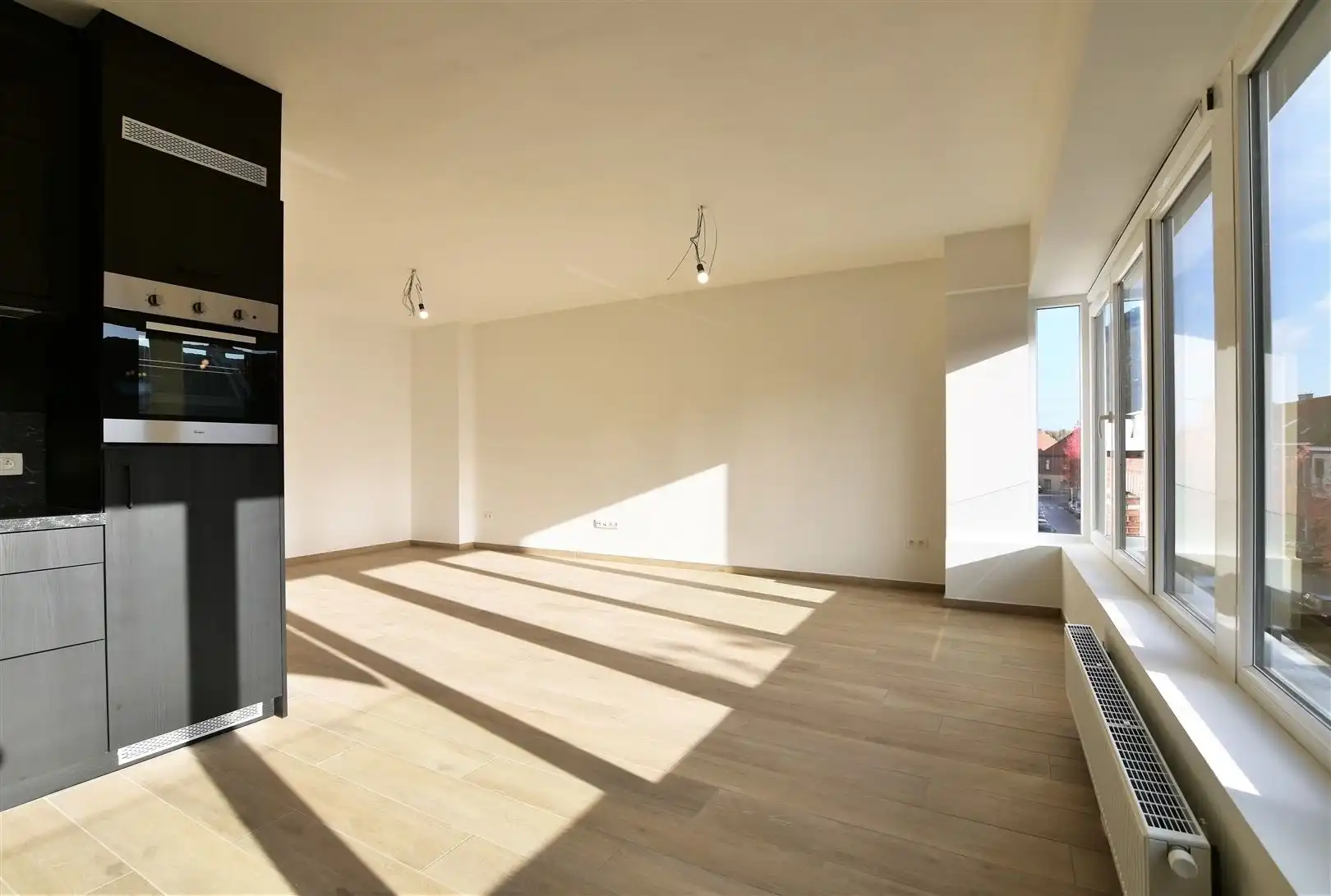 Prachtig dakappartement met terras, gelegen in het hartje van Sint-Gillis-Dendermonde. foto 8