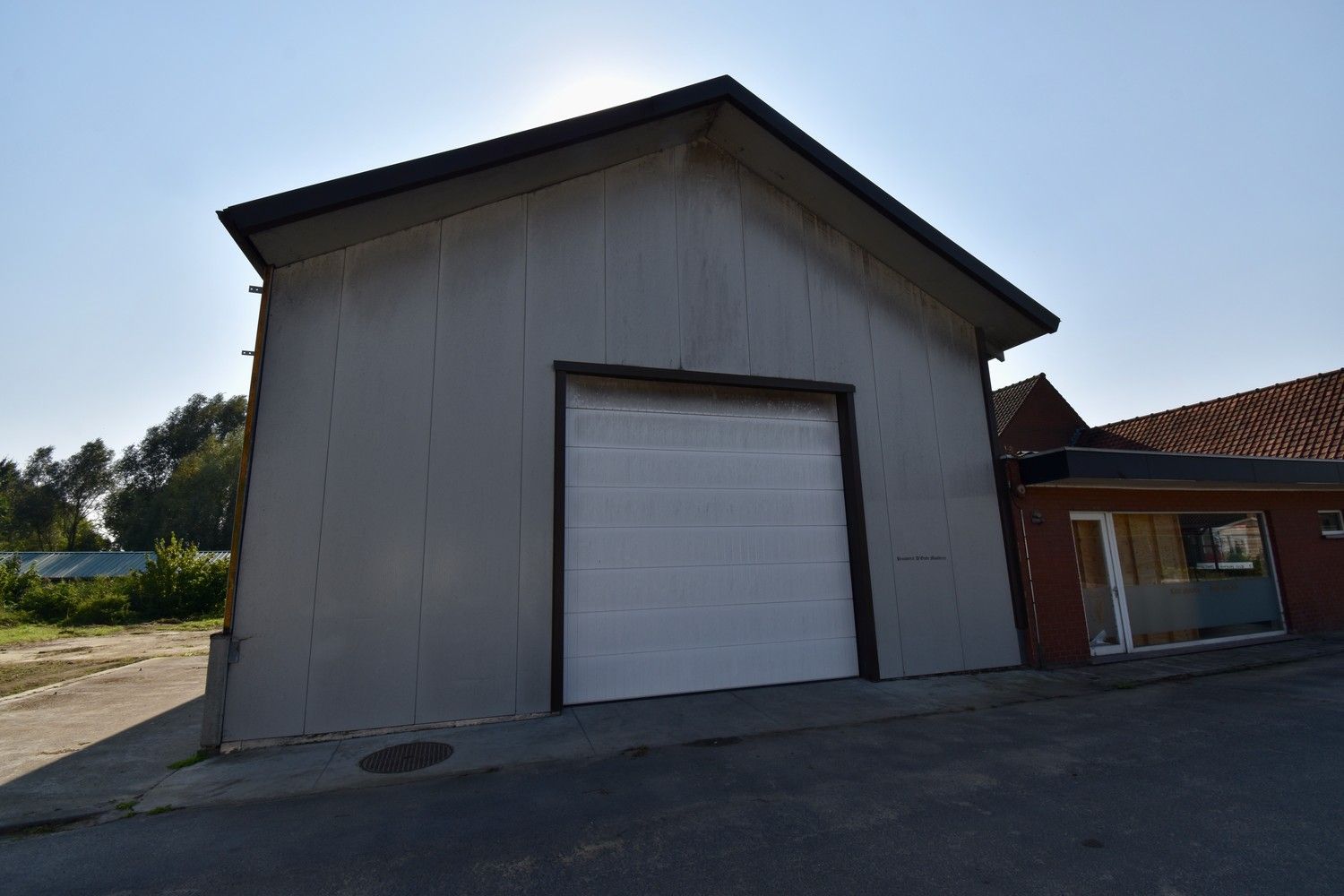 Polyvalent gebouw bestaande uit winkelruimte, appartement en loods foto 46