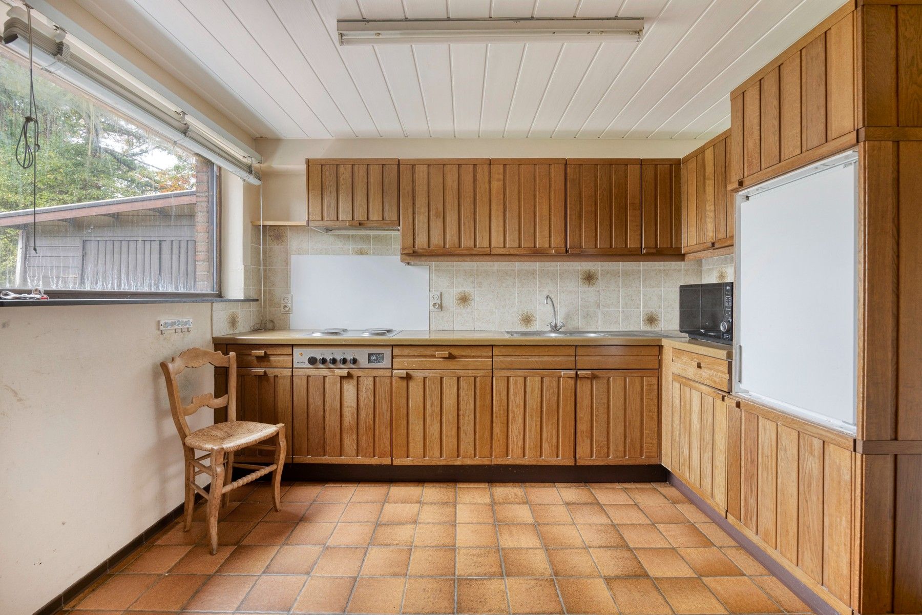 In de geliefde Tweebunderswijk woning met 4 slaapkamers, garage en tuin foto 4