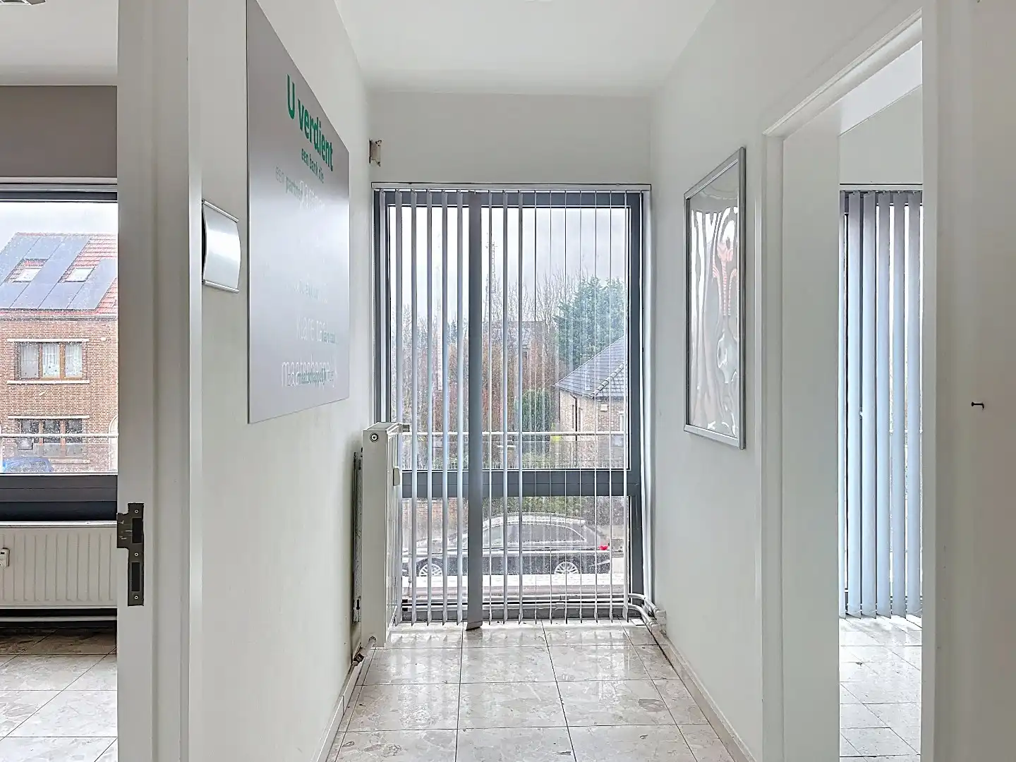 Veelzijdig pand op topligging: wonen en werken of tweewoonst met terrassen en garage foto 9