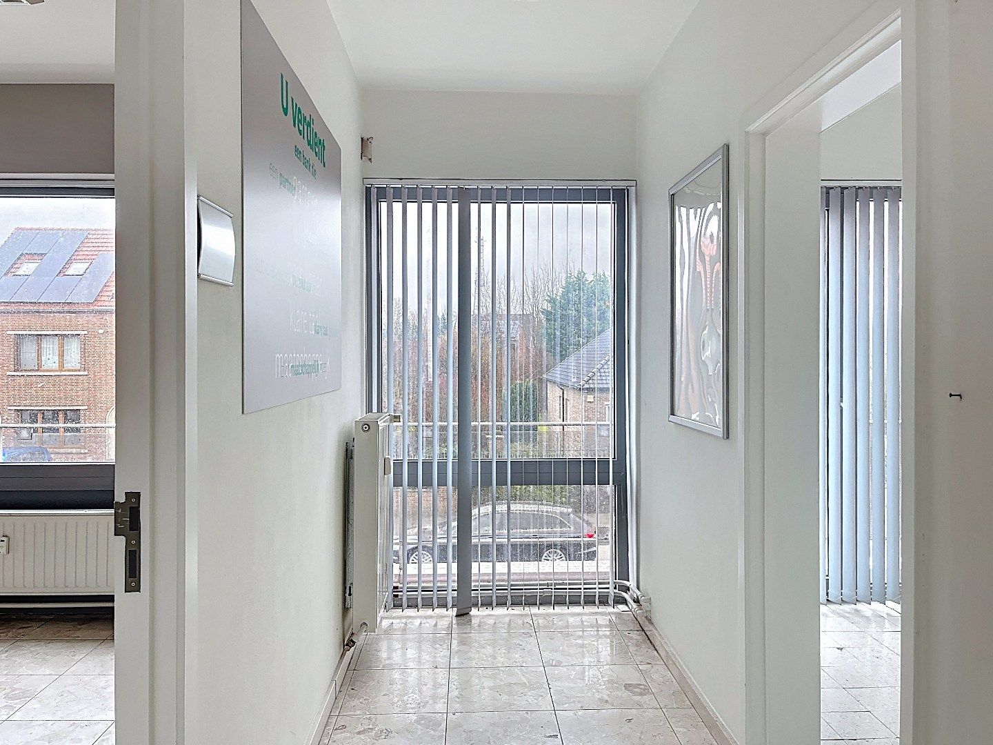 Veelzijdig pand op topligging: wonen en werken of tweewoonst met terrassen en garage foto 9