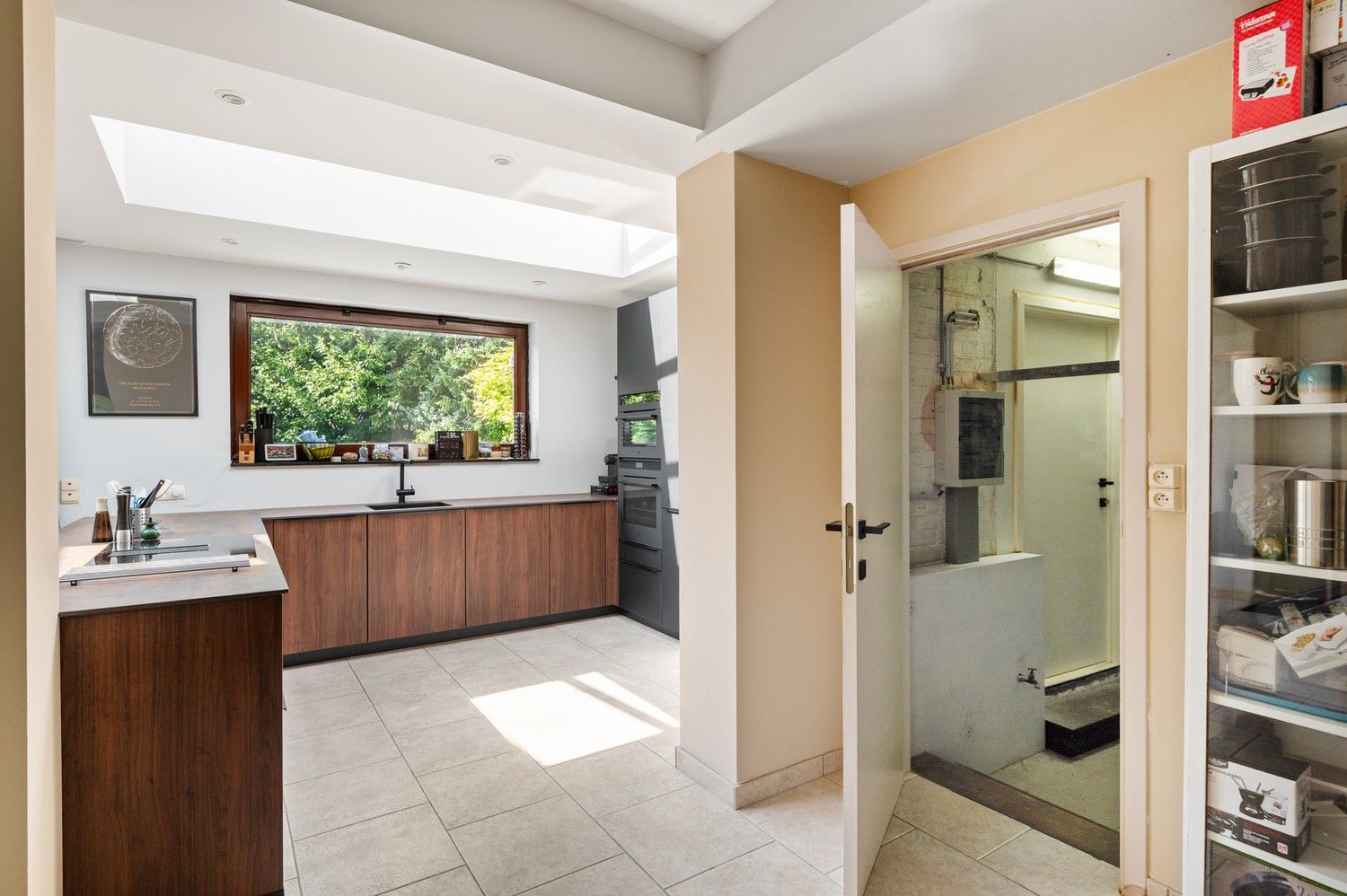 Gezellige woning met 3 slaapkamers, veranda en tuin te koop in top buurt te Ekeren! foto 10